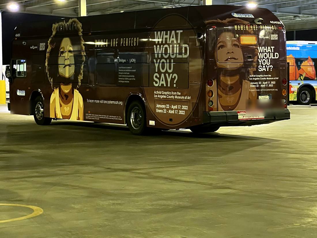 AVTA museum ad wrap bus